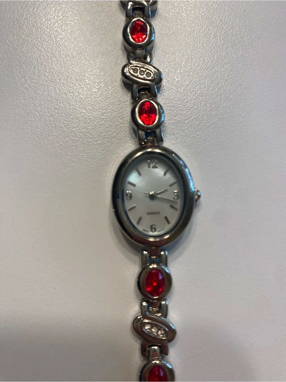 Silver Women's Bracelet Watch with Ruby Stone Accents